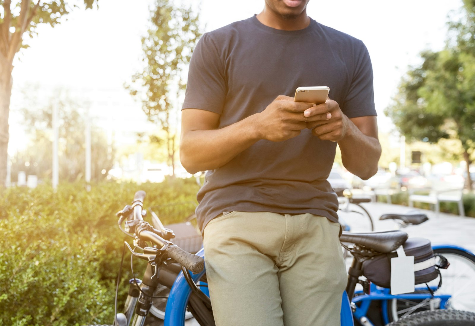 A citizen connecting to free Wi-Fi on a phone in a municipal square