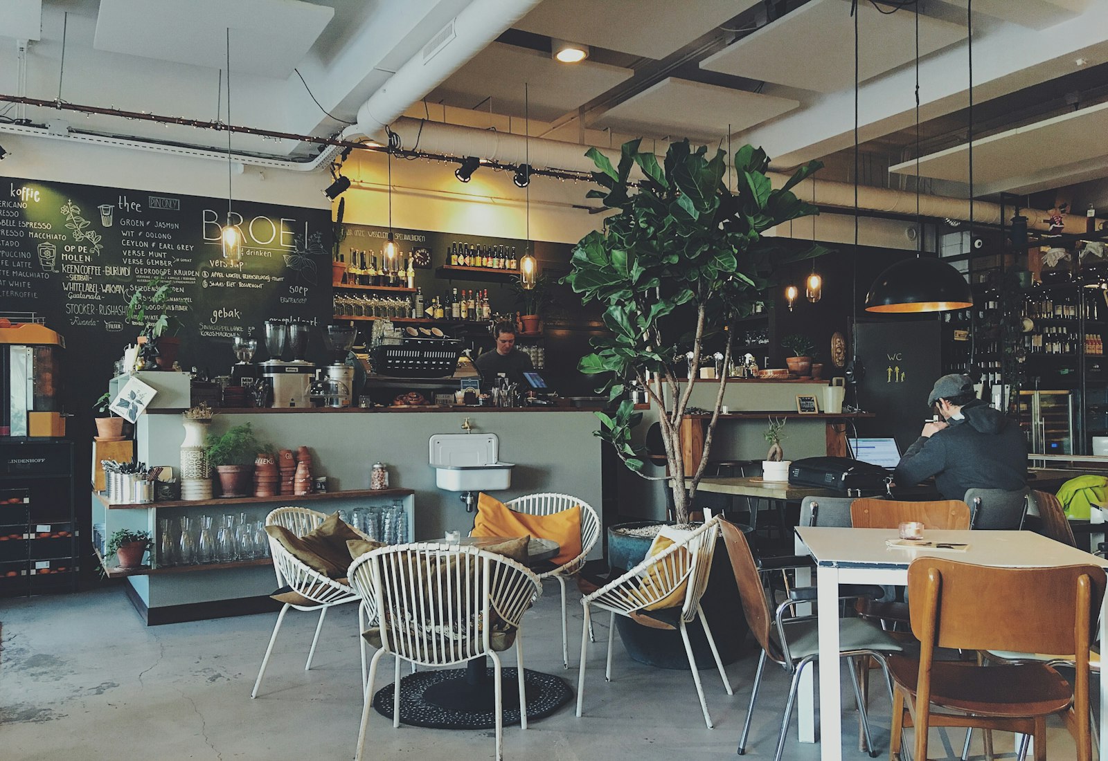 A customer connecting to Wi-Fi on a phone at a cafe table